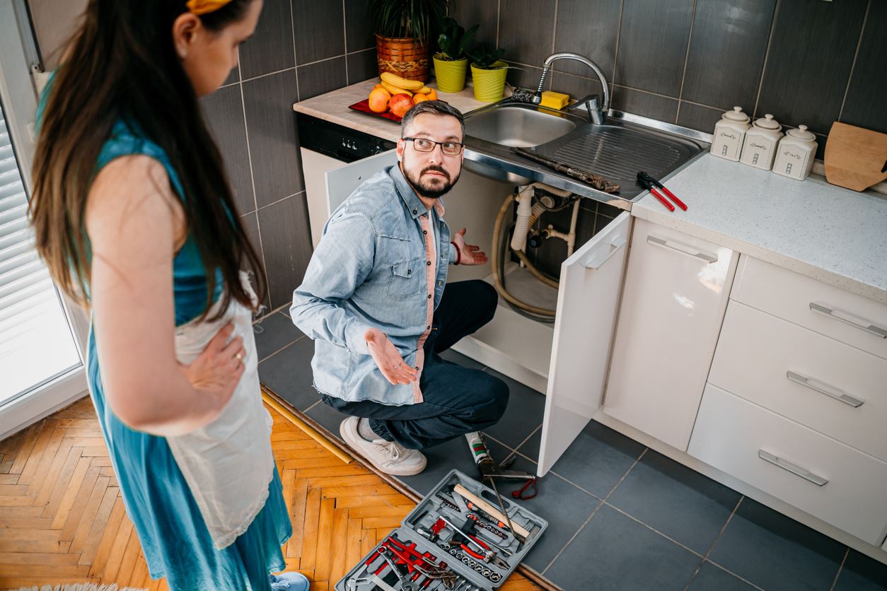 Man Talking to Woman About Drain