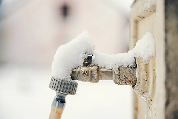 outdoor faucet in winter